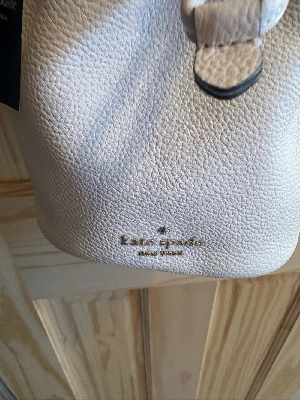 kate spade Cream Pebbled Leather Drawstring Crossbody with Striped Strap